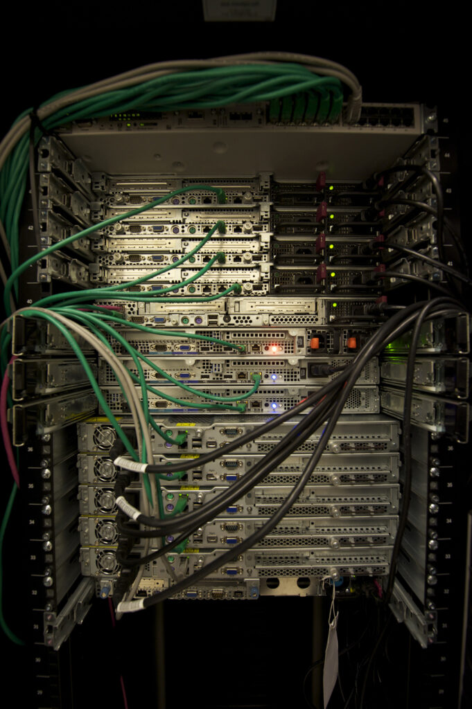 Multiple servers mounted vertically in an equipment rack.